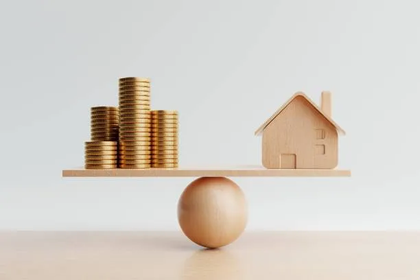 Conceptual illustration of saving or overpaying a mortgage with scales and coins